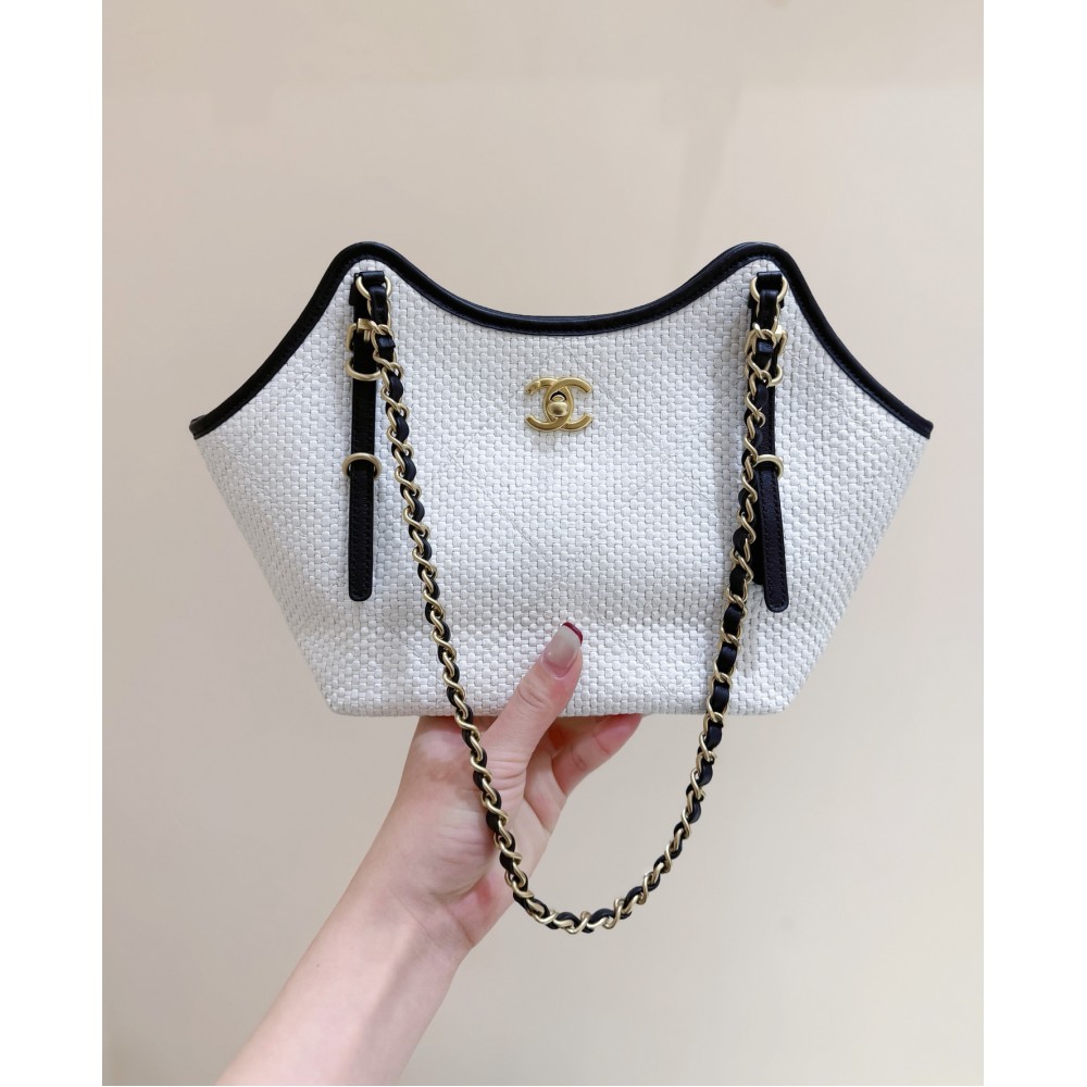 Chanel Maxi shopping bag, Braided raffia, calfskin & gold-tone