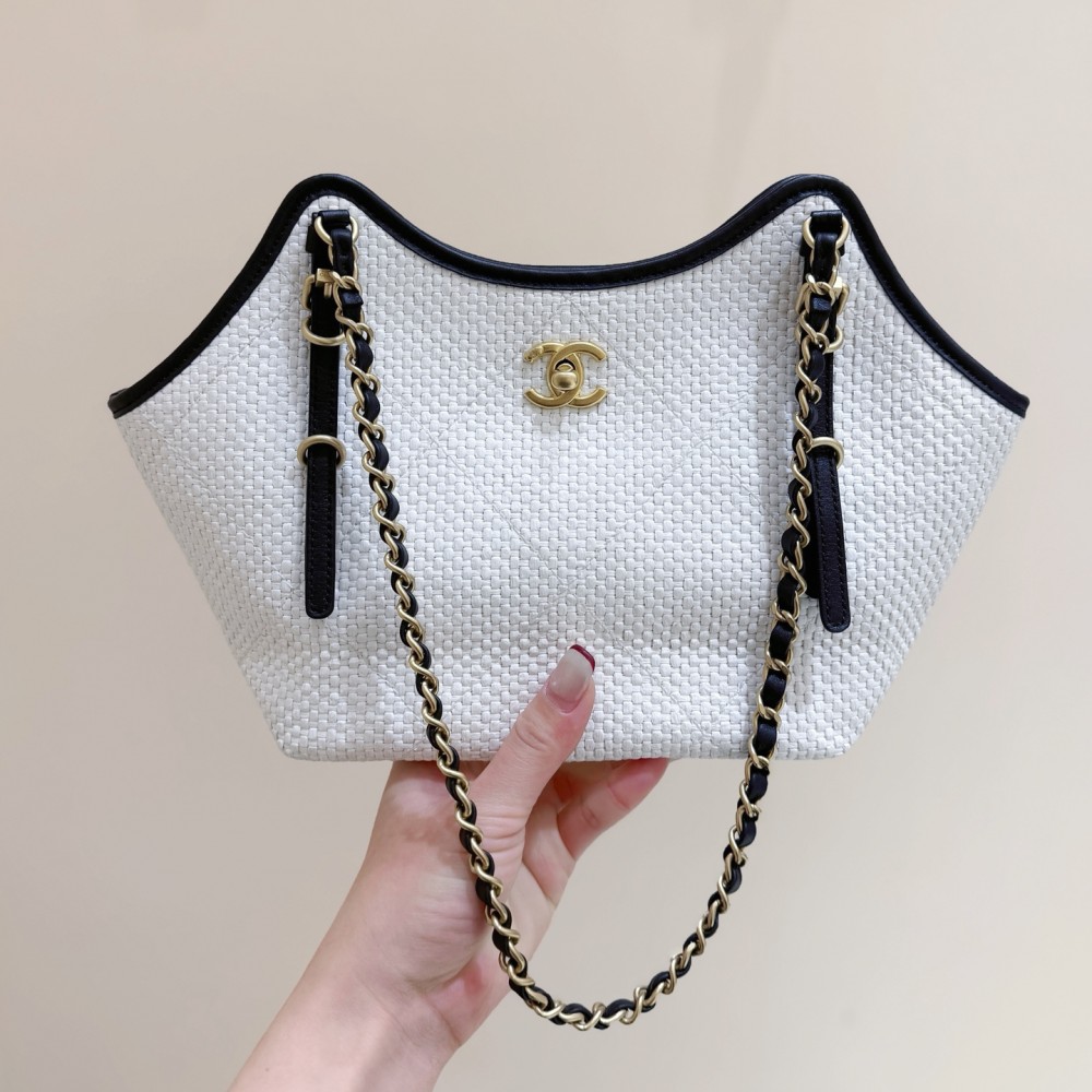 Chanel Maxi shopping bag, Braided raffia, calfskin & gold-tone
