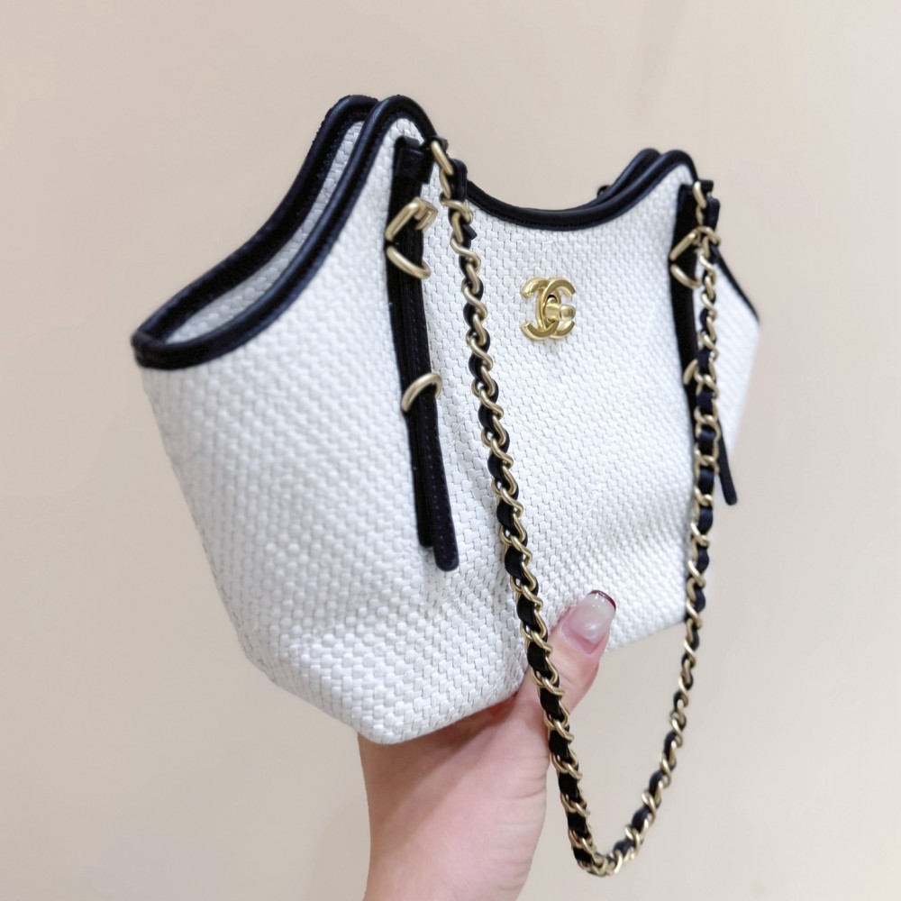 Chanel Maxi shopping bag, Braided raffia, calfskin & gold-tone