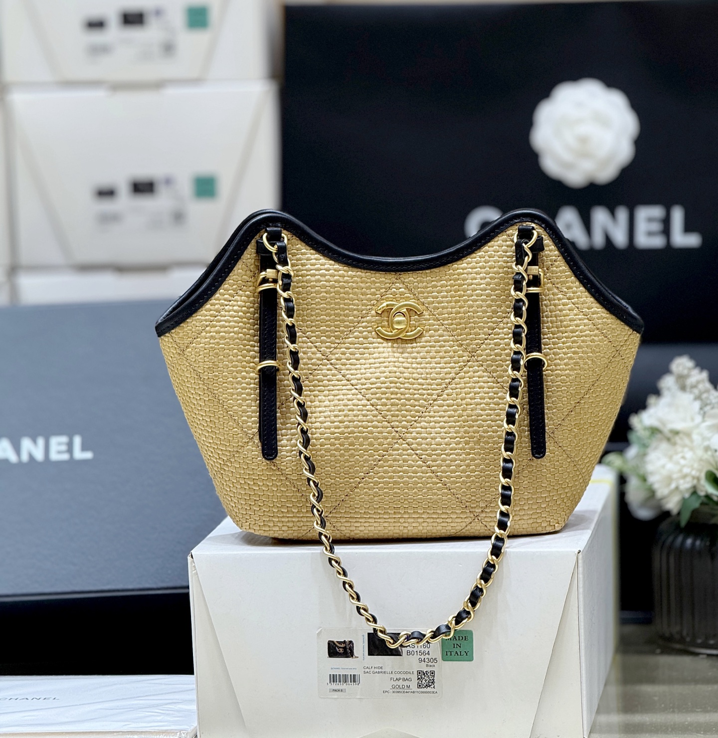 Chanel Maxi shopping bag, Braided raffia, calfskin & gold-tone Apricot