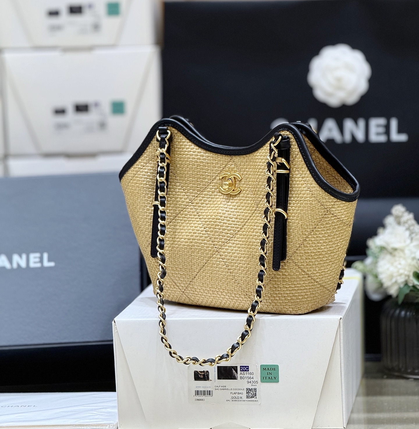 Chanel Maxi shopping bag, Braided raffia, calfskin & gold-tone Apricot