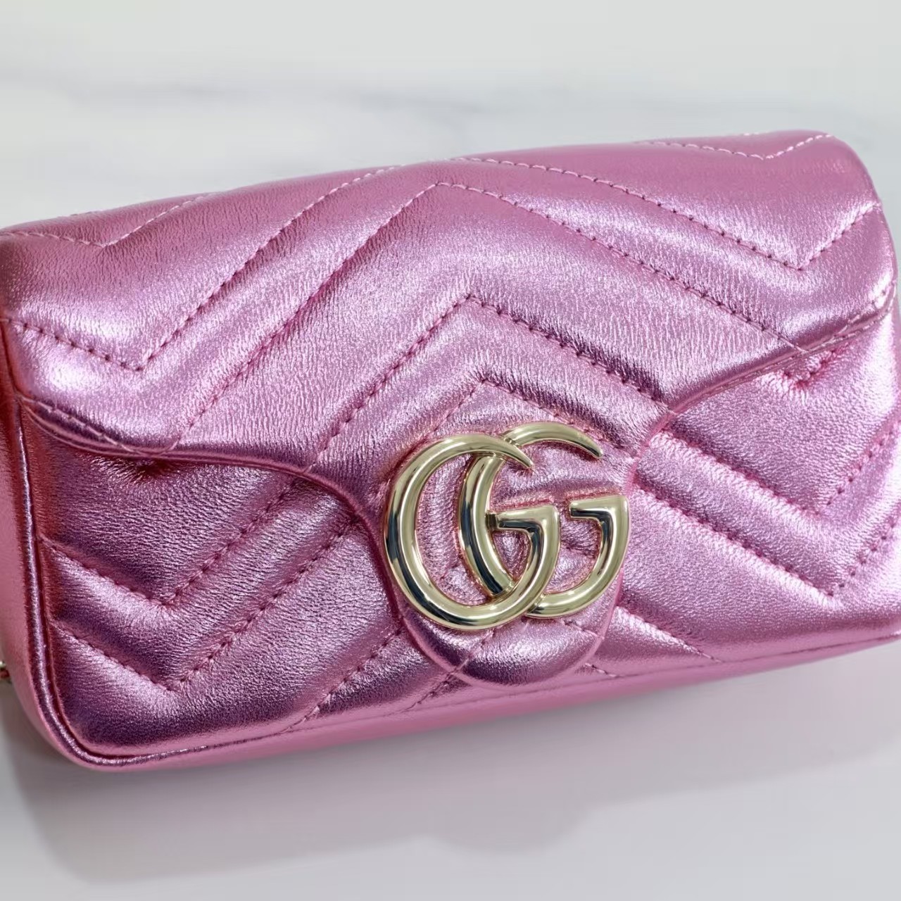 GUCCI Marmont small shoulder bag in bright pink lame leather