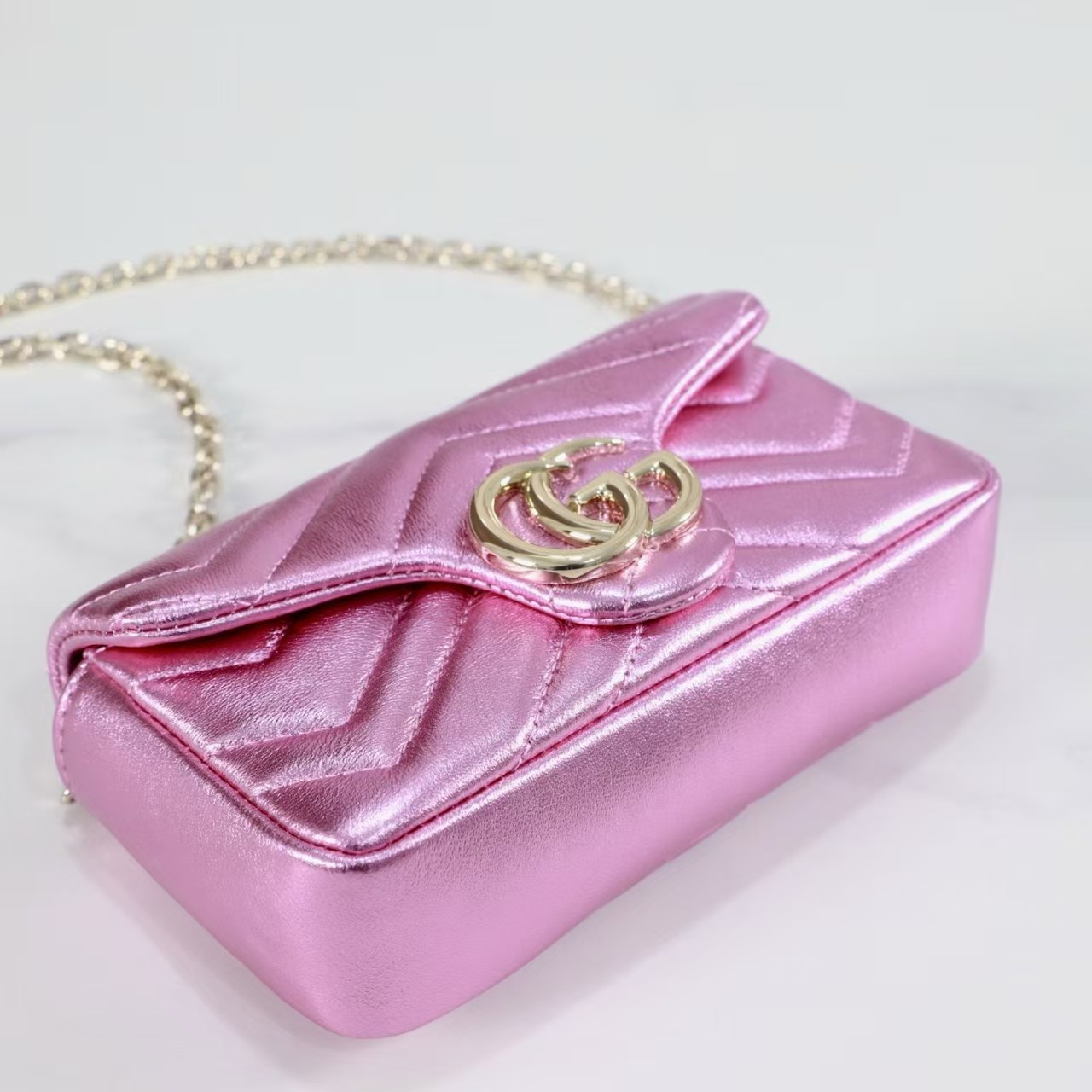GUCCI Marmont small shoulder bag in bright pink lame leather