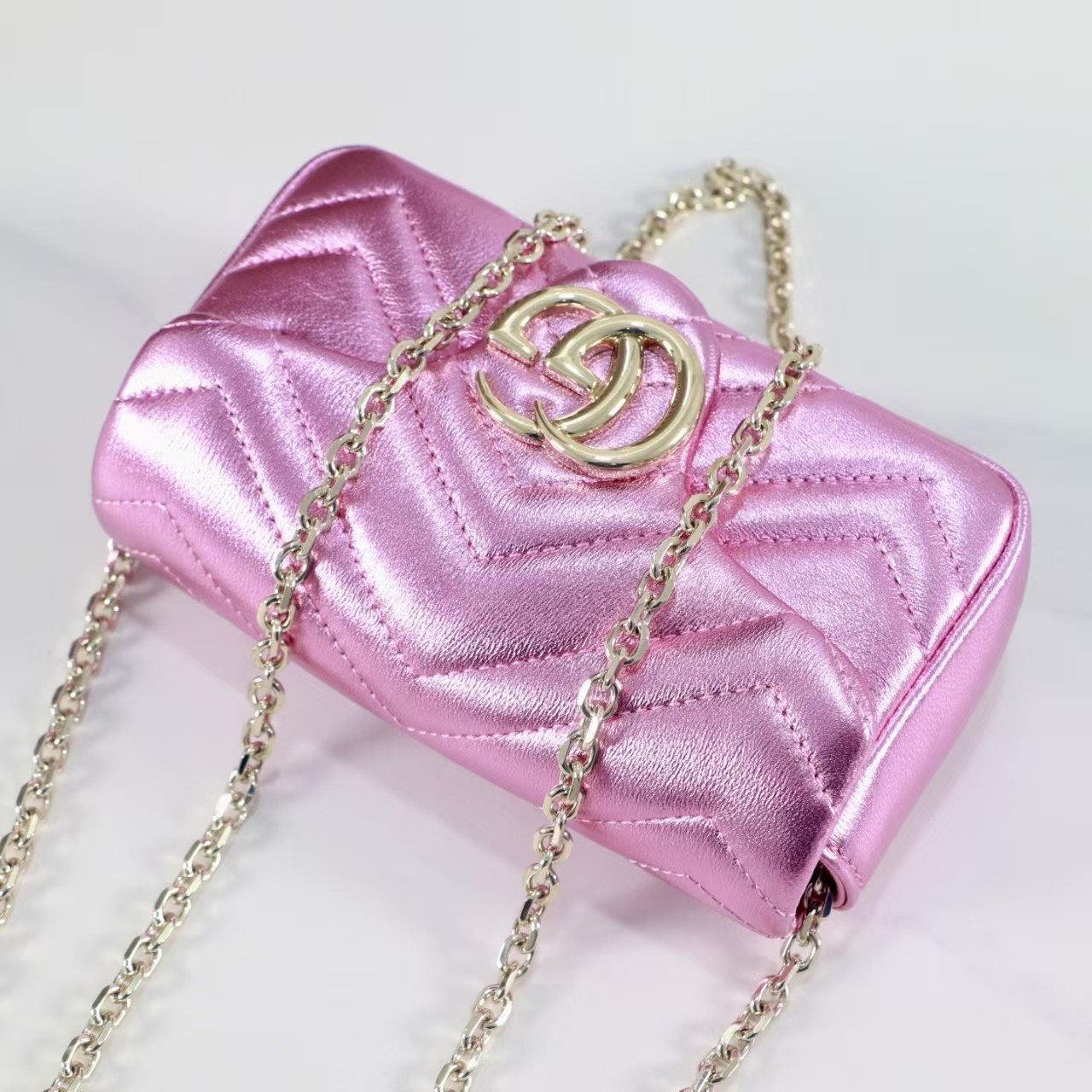 GUCCI Marmont small shoulder bag in bright pink lame leather