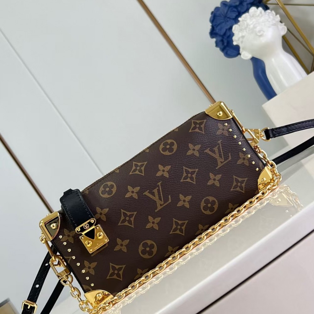 Louis Vuitton Slim Trunk handbag in classic monogram canvas with gold-tone hardware