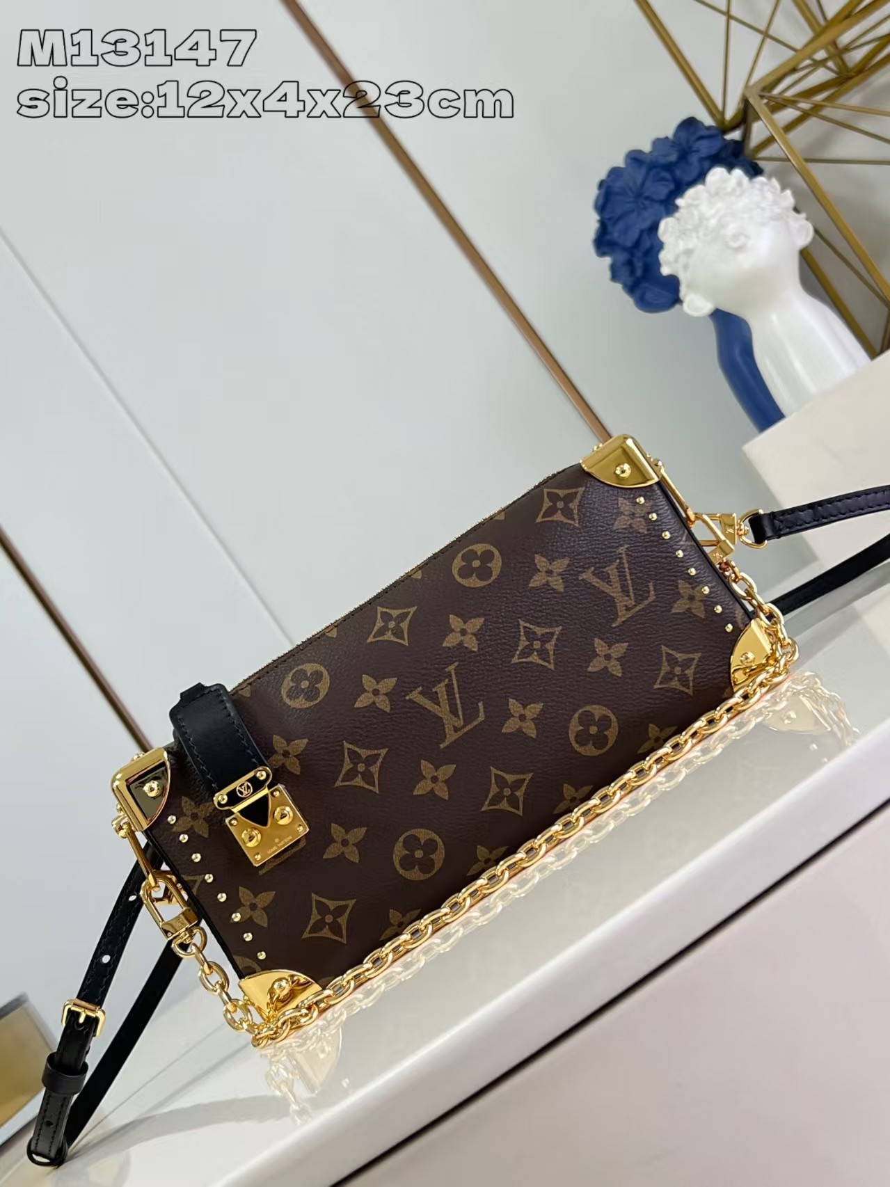 Louis Vuitton Slim Trunk handbag in classic monogram canvas with gold-tone hardware
