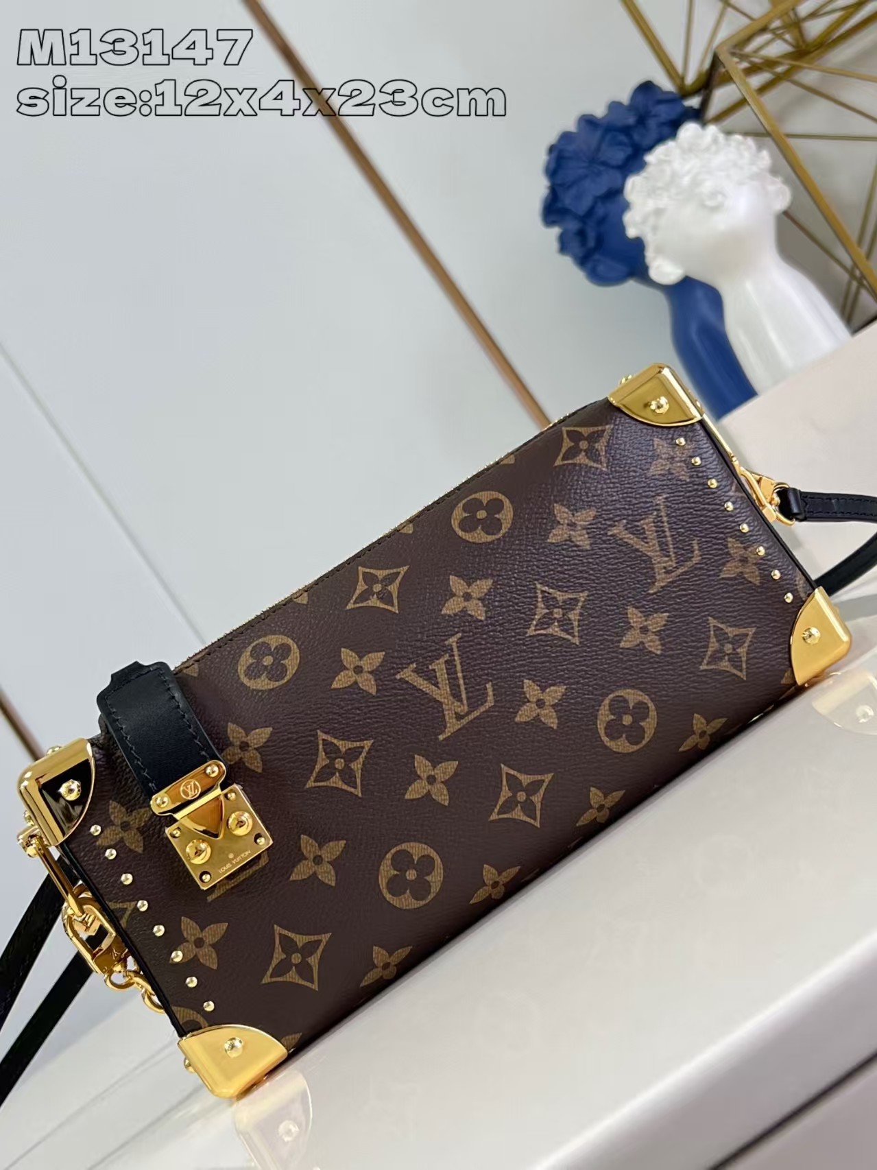 Louis Vuitton Slim Trunk handbag in classic monogram canvas with gold-tone hardware
