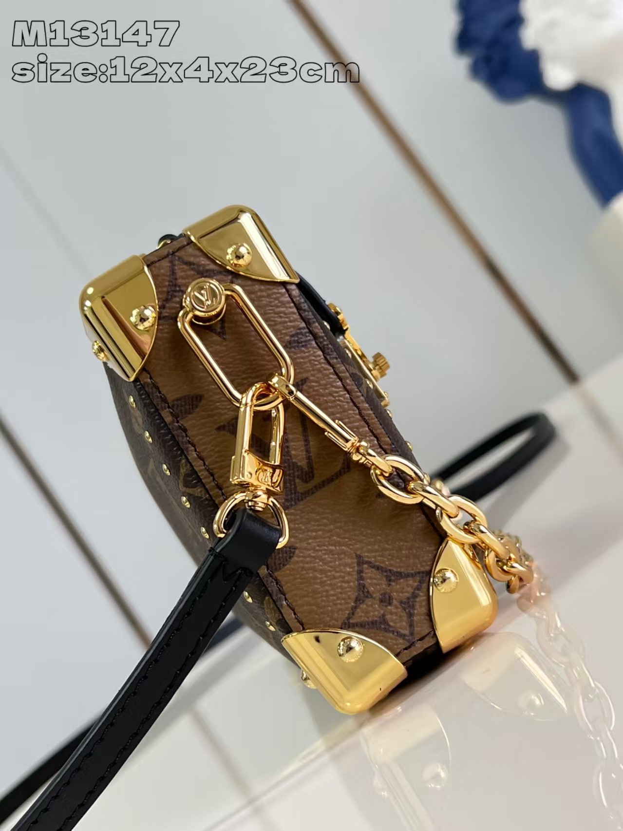 Louis Vuitton Slim Trunk handbag in classic monogram canvas with gold-tone hardware