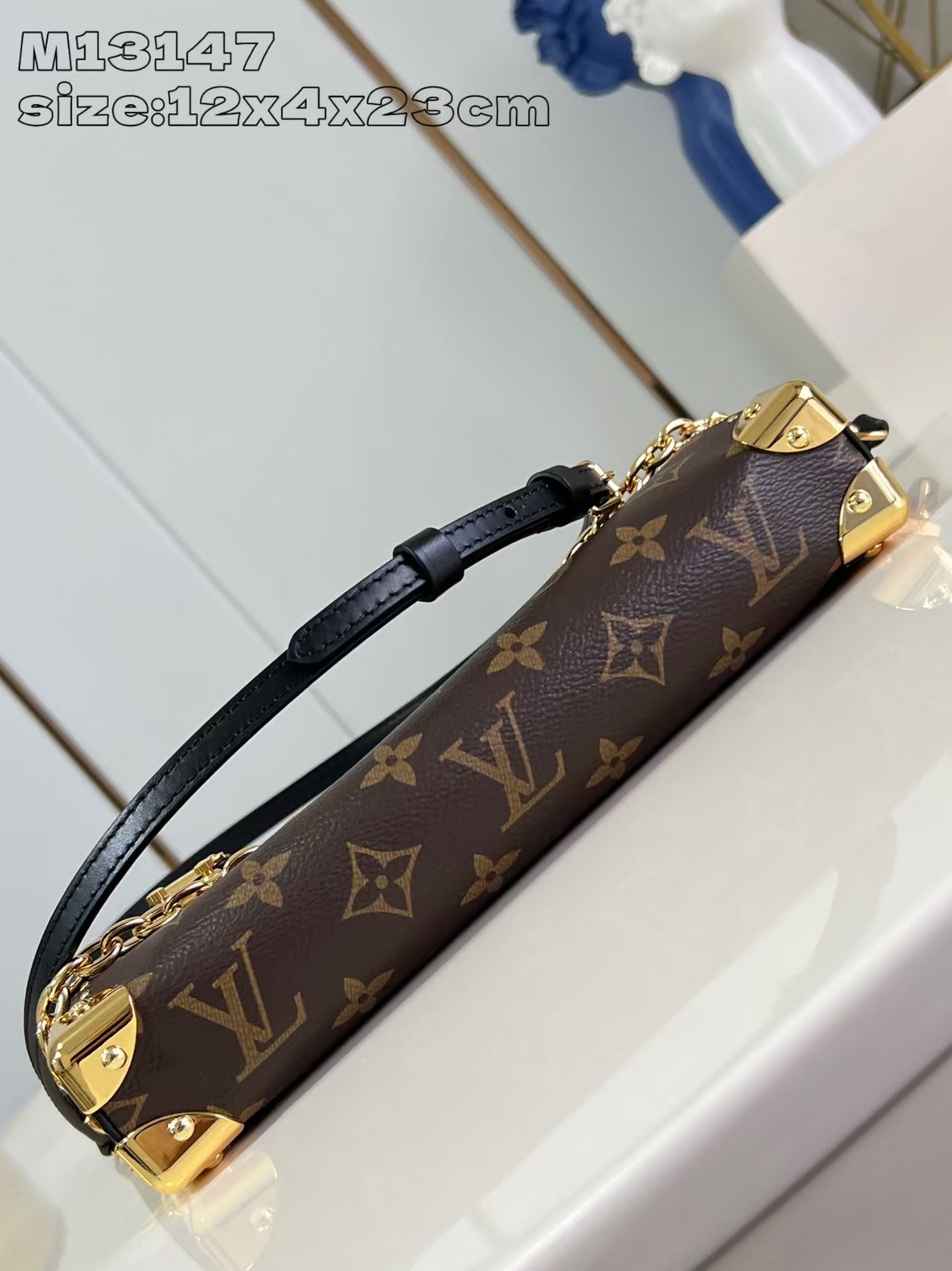 Louis Vuitton Slim Trunk handbag in classic monogram canvas with gold-tone hardware