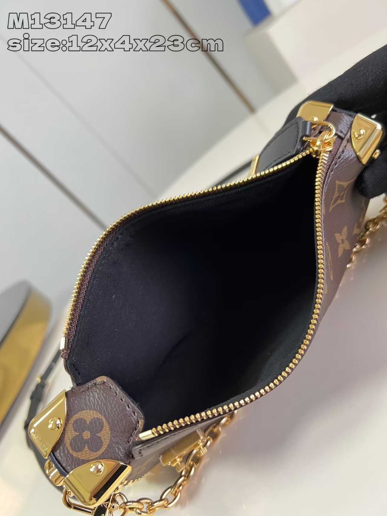 Louis Vuitton Slim Trunk handbag in classic monogram canvas with gold-tone hardware